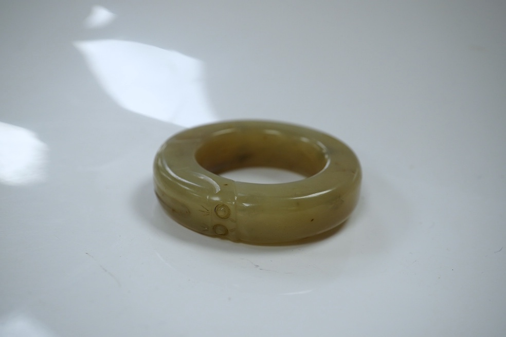 Two Chinese soapstone bi discs, and a jade ring, 18th century or earlier, largest 6.5cm in diameter. Condition - good